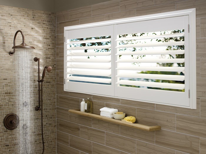 white shutters over windows in bathroom shower